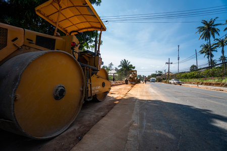 THAILAND, PHUKET - December 12, 2018: Road rollers working on the new roads construction site. Heavy...