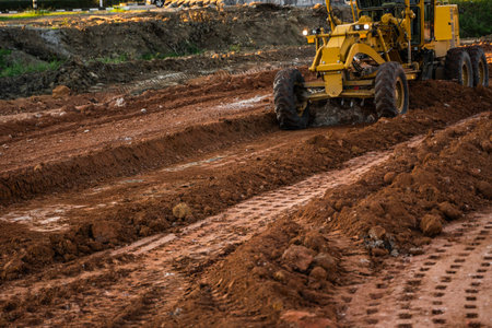 Grader is working on road construction. Grader industrial machine on construction of new roads....