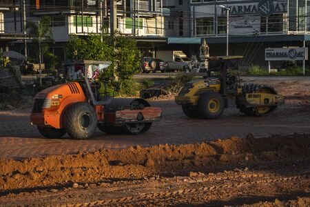 VIETNAM, HO CHI MINH - May 15, 2019: Road rollers working on the new roads construction site. Heavy duty machinery working on highway. Construction equipment. Compaction of the road.のeditorial素材