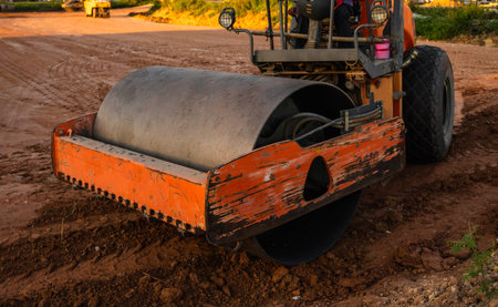 Road rollers working on the new roads construction site. Heavy duty machinery working on highway....