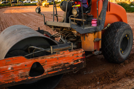 Road rollers working on the new roads construction site. Heavy duty machinery working on highway....
