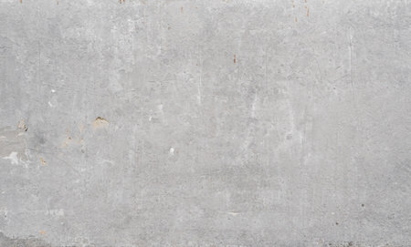 Texture of old concrete wall for background. White concrete wall background with a cracks nad holes