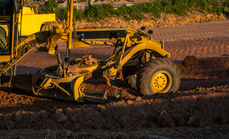 Grader is working on road construction. Grader industrial machine on construction of new roads....