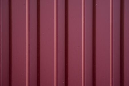 Red Corrugated metal sheet texture surface of the wall. Galvanize steel backgroundの写真素材