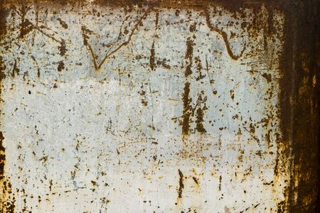 Painted metal rusted background. Metal rust texture. Erosion metal. Scratched and dirty texture on outdoor rusted metal wall.の写真素材