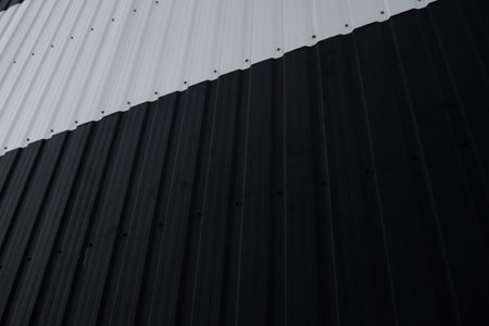 Black and white Corrugated metal sheet surface of the wall. Galvanize steel background