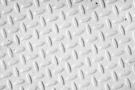 Steel dirty and used checker plate metal sheet. Can be use as background or textureの写真素材