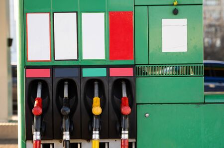 Four fuel pumps at a gas station.の写真素材