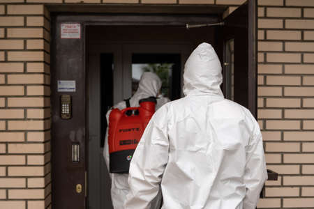 UKRAINE, KYIV - May 20, 2020: Sanitizing interior surfaces. Cleaning and Disinfection inside buildings, the coronavirus epidemic. Professional teams for disinfection efforts. Infection prevention and control of epidemic.のeditorial素材