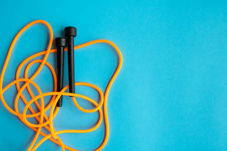 Skipping rope on blue background. Skip rope.の写真素材
