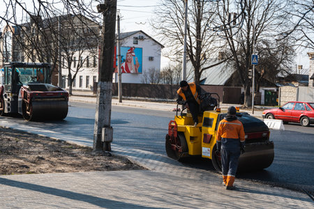 KYIV, UKRAINE - September 10, 2020: Heavy asphalt road roller with heavy vibration roller compactor...