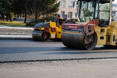 KYIV, UKRAINE - September 10, 2020: Heavy asphalt road roller with heavy vibration roller compactor...