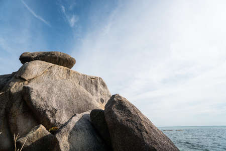 Huge cliff and sea with a cloudy blue sky.の写真素材