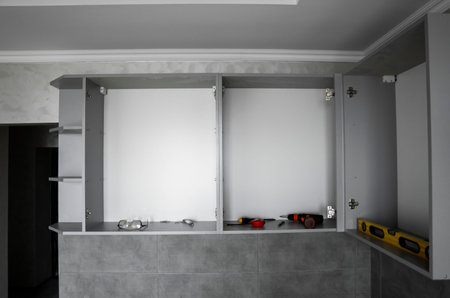 Custom kitchen cabinets installation without a furniture facades mdf. Gray modular kitchen from...