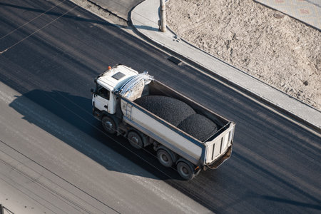 Truck with a breakstone on a road in the city during road construction work.の写真素材