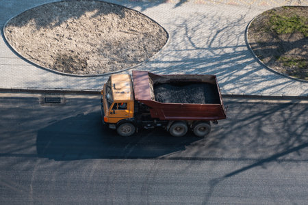 Truck with a breakstone on a road in the city during road construction work.の写真素材