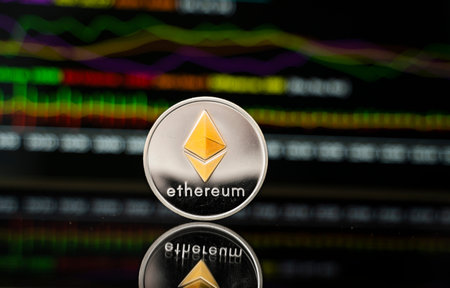 Silver and Gold ethereum coin with a graph chart. Trading on the cryptocurrency exchange....