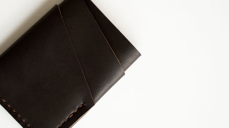 Brown empty mens business handmade leather card holder with isolated on white background. Selective...