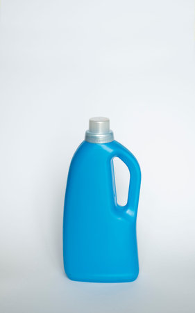 Large blue plastic bottle with gel for washing isolated on a white background. Laundry container,...