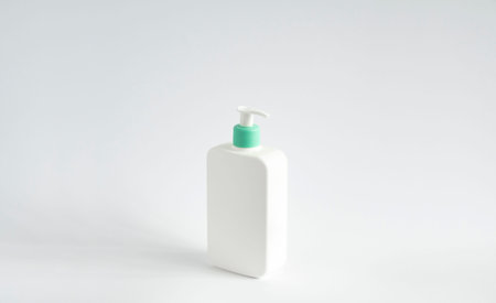 Liquid container for gel, lotion, cream, shampoo, bath foam. Cosmetic plastic bottle with green...
