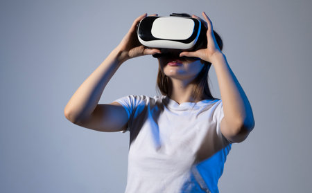 Metaverse technology concept. Woman with VR virtual reality goggles is playing a game with a friends in metaverse.の写真素材