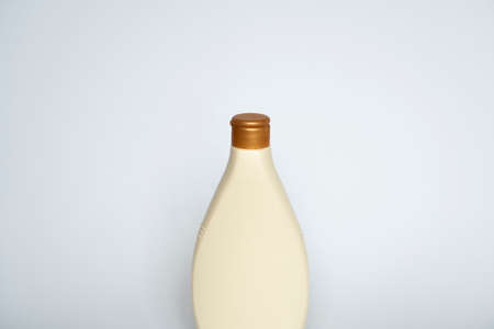 Beige blank plastic bottles isolated on white background.の写真素材