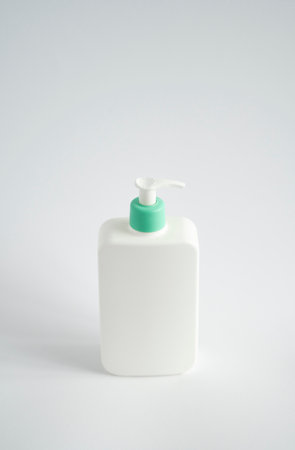 White unbranded dispenser shampoo, gel, soap bottle isolated on white background. Cosmetic packaging mockup with copy space.の写真素材