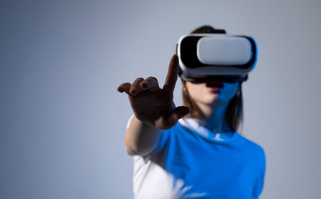 Female engineer wearing virtual reality headset designing a new pruducts or technologis using VR technology. Development and prototyping software.の写真素材