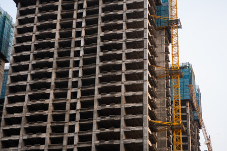 Close view of raw concrete columns and floors in unfinished building structureの写真素材
