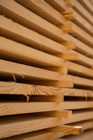 Angled side view of timber stack showing textured plank edgesの写真素材