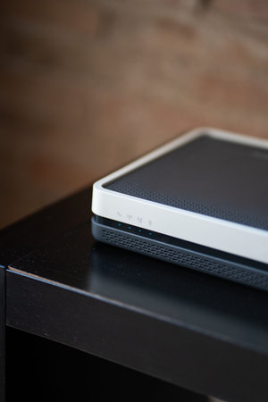 Modern wireless router with illuminated status lights providing high-speed internet connectivity for...