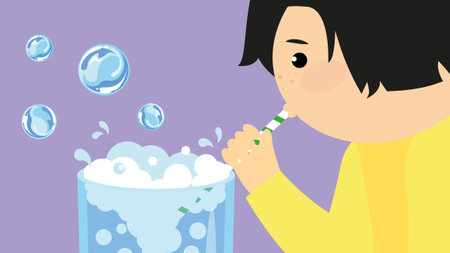 A boy blows through a tube into a bowl of soapy water. Vector illustration in cartoon style.のイラスト素材