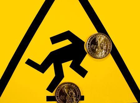 Warning sign. Strike a snag, fall over financial failure. The financial market is unpredictable.の写真素材