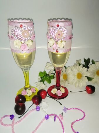 glasses with champagne on a white backgroundの写真素材