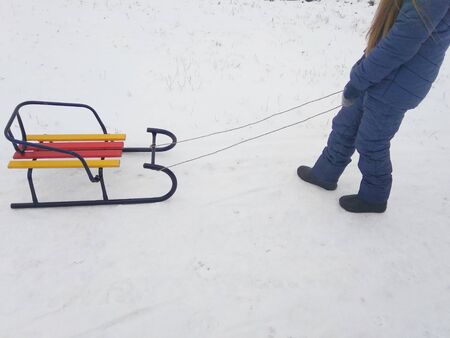 girls go sledding downhillの写真素材