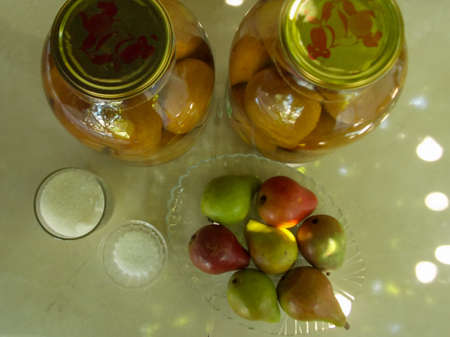 canned pears on the tableの写真素材