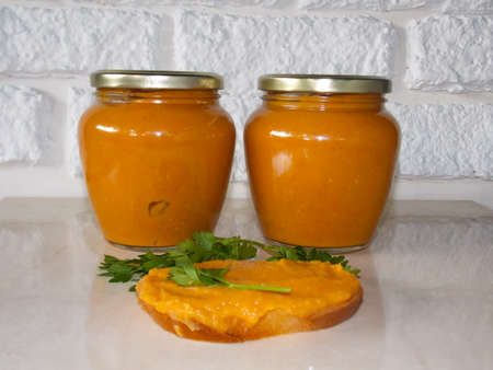 Zucchini caviar in jars on the tableの写真素材