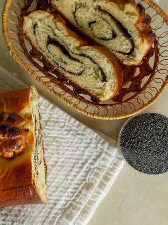 Poppy seed roll on the tableの写真素材