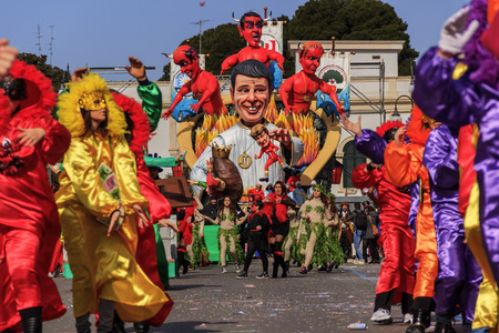 Putignano, Apulia, Italy - February 15, 2015: Carnival floats, giant paper mache. Giants italian politicians: Matteo Renzi. Carnival costume.のeditorial素材