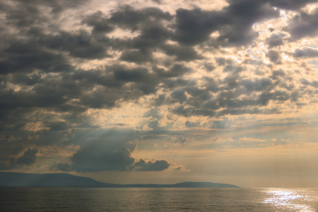Gargano coast: sea horizon with cloudy sunset.Apulia, ITALY. Panoramic view of the Apulian coastline.の写真素材