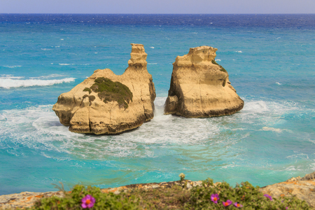The most beautiful coast of Apulia: Torre Dell'Orso Bay, ITALY (Lecce). Typical seascape of  adriatic coastline of Salento: view of the two stacks called The Two Sisters (or Due Sorelle).の写真素材