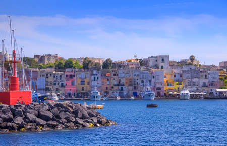 Panoramic view of Procida, Italian Capital of Culture 2022: colorful houses, cafes and restaurants, fishing boats and yachts in Marina Grande , in Bay of Naples, Campania, Italy.の写真素材