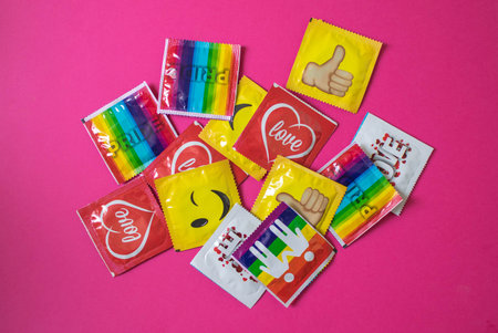 Poland, Poznan, July 2018. Pots of condoms in bright packages.のeditorial素材