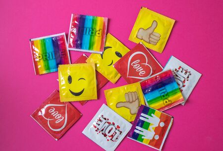 Poland, Poznan, July 2018. Pots of condoms in bright packages.のeditorial素材