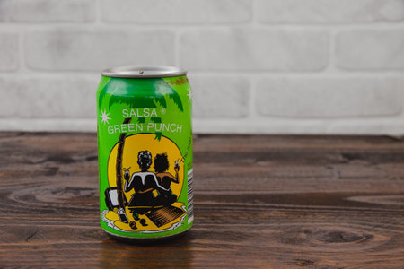 A vintage aluminum can of Salsa soft drink against the brick wal
