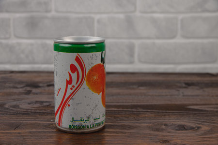A vintage aluminum can of Rouiba soft drink against the brick wal