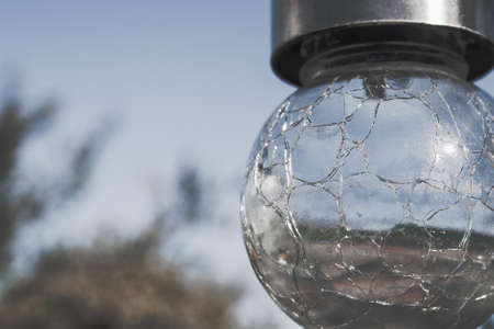 small round garden lamp closeup with a sky on the backgroundの写真素材