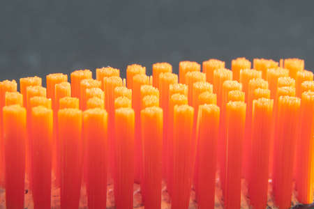 Orange toothbrush bristles close upの写真素材