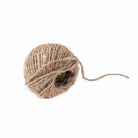 A ball of natural jute twine, isolated on a white background. Close upの写真素材