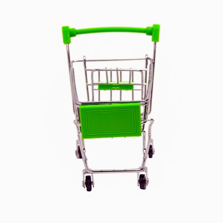 An empty shopping cart with a green handle, isolated on a white background. Close-up front viewの写真素材